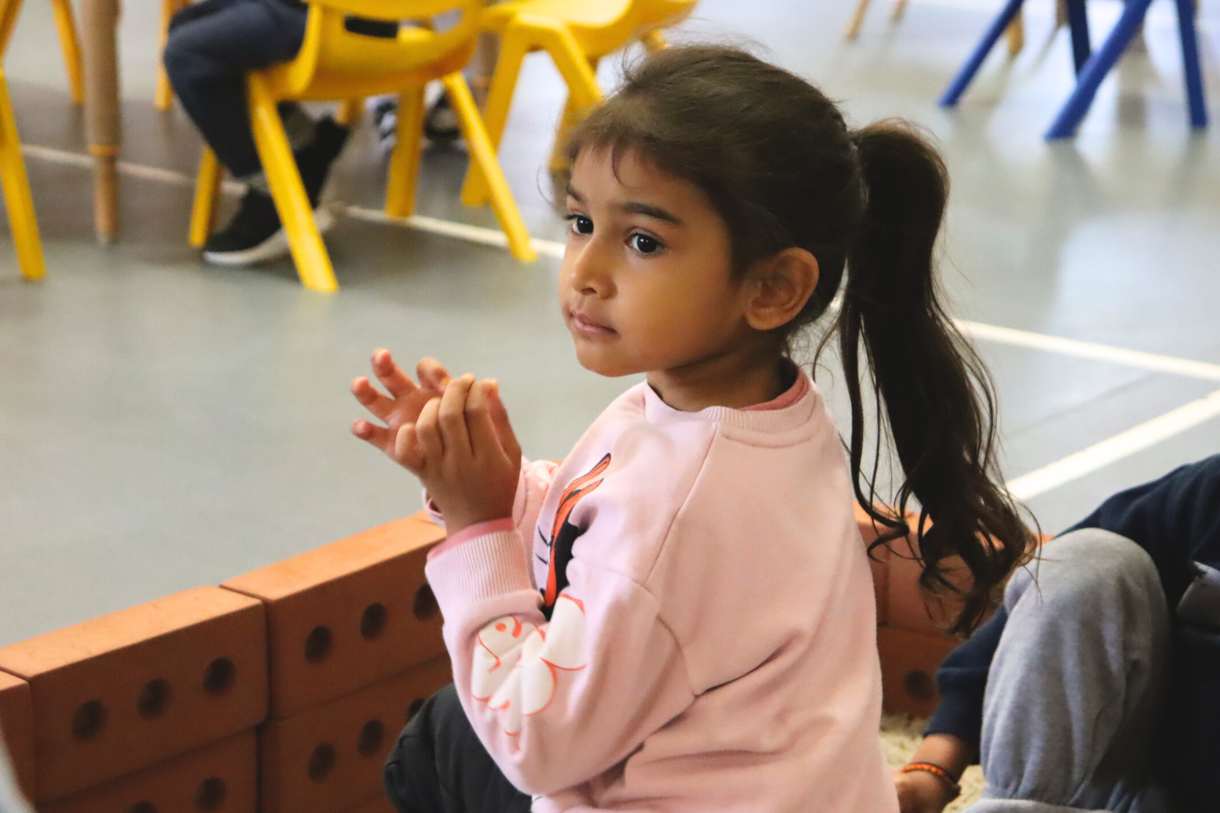 a Budding Learner's preschooler working on a Montessori activity on his own