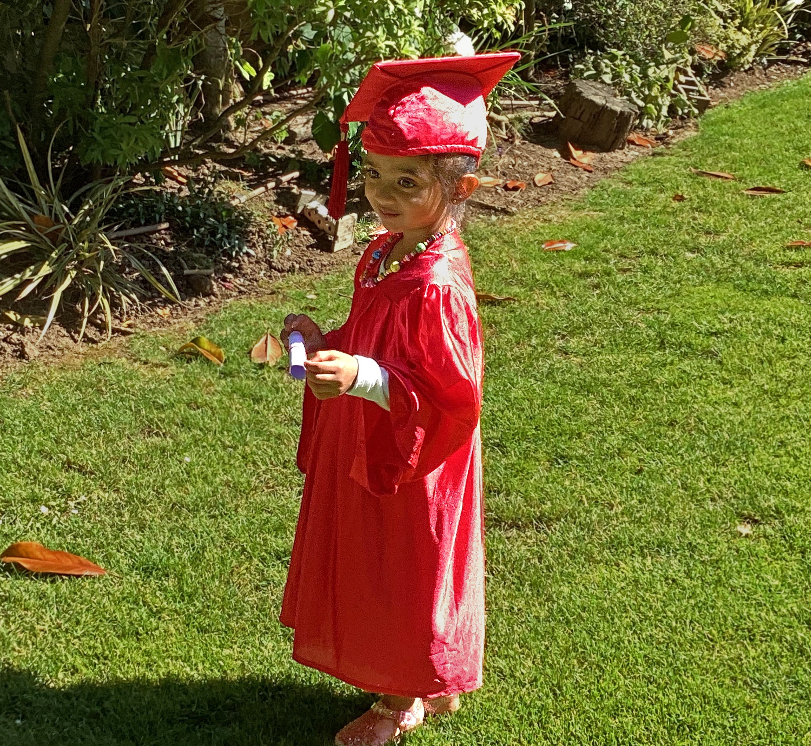 A Little learners' preschooler posing during her Graduation ceremony